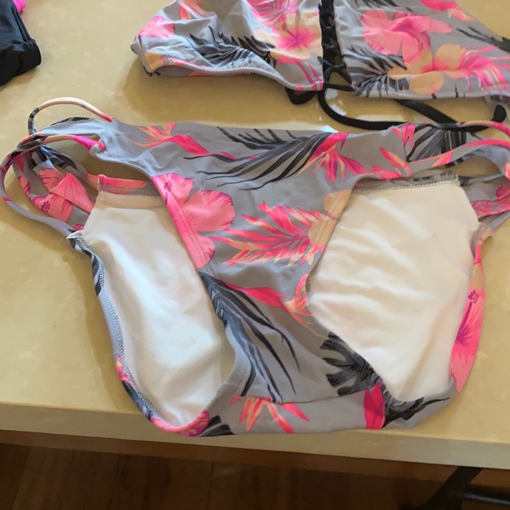 2 bikini tops and one matching bottom